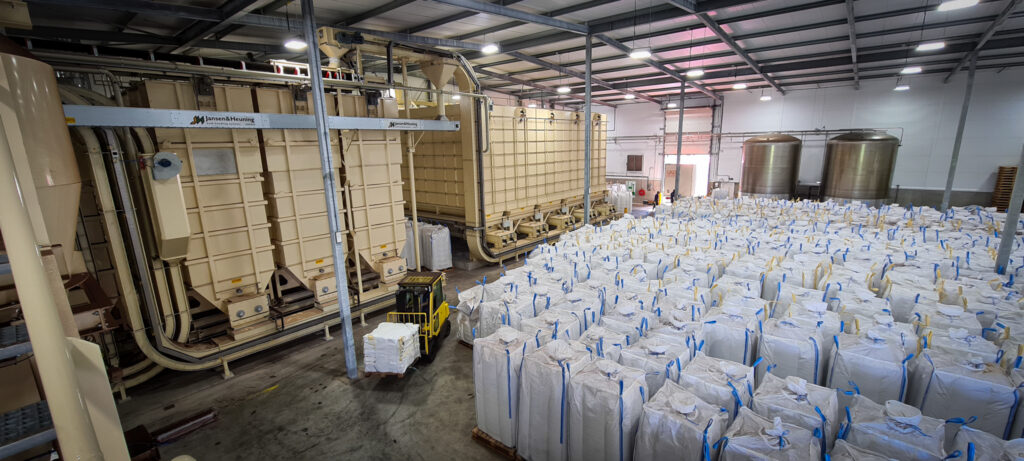 An industrial factory where a lot of big bags are stored.